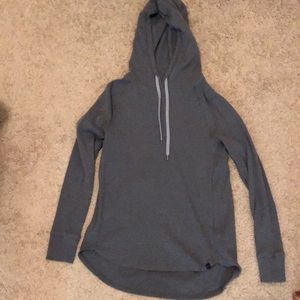 Womens grey/blue underarmour large waffle tee. Flattering cut with long back